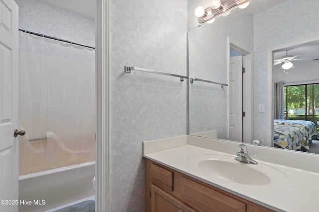 full bathroom with shower / tub combo with curtain, vanity, ensuite bath, and wallpapered walls