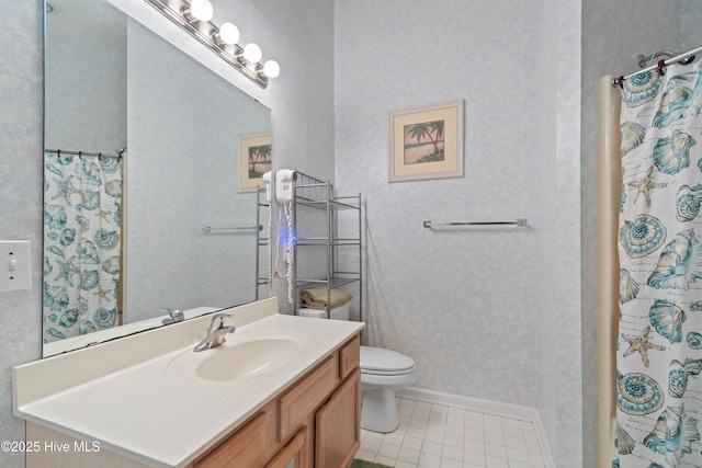 bathroom with toilet, tile patterned floors, vanity, baseboards, and a shower with curtain