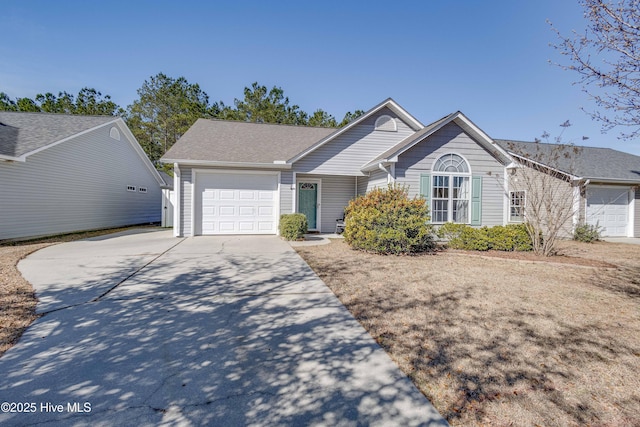 single story home with an attached garage and driveway