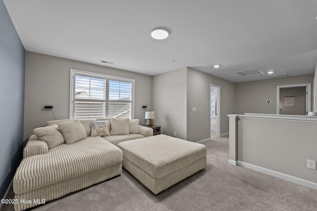 carpeted living area featuring recessed lighting, visible vents, baseboards, and attic access