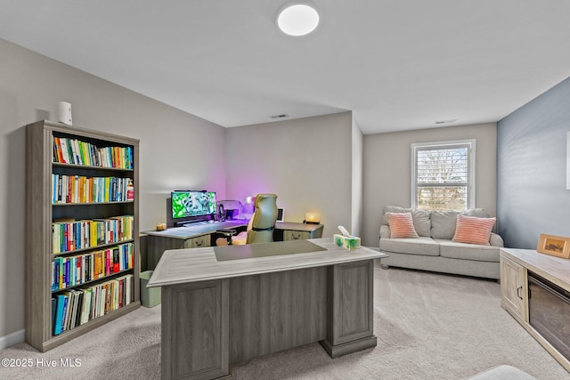 home office featuring visible vents and light colored carpet