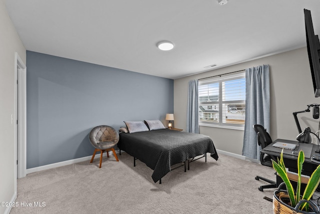 bedroom featuring visible vents, baseboards, and carpet flooring