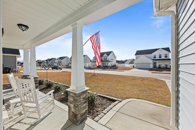 view of patio / terrace featuring a residential view and a porch