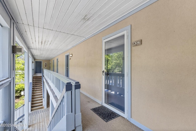 entrance to property with stucco siding