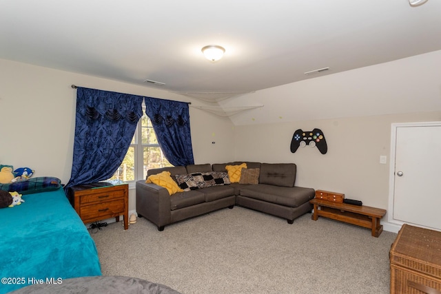 bedroom featuring carpet, visible vents, and vaulted ceiling