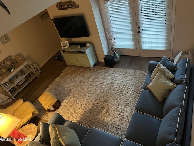 living area with light wood finished floors and baseboards