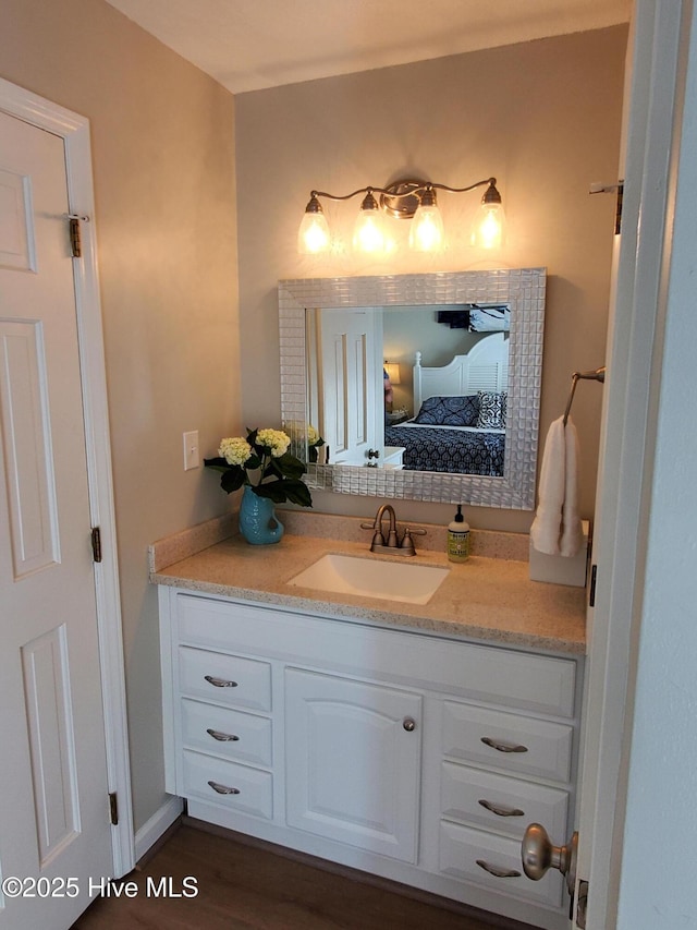 bathroom featuring vanity and ensuite bath