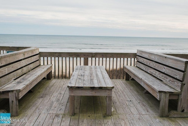 wooden terrace with a water view