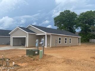 121 Sycamore Rd, Southport, NC 28461 - view of front of property featuring an attached garage and driveway