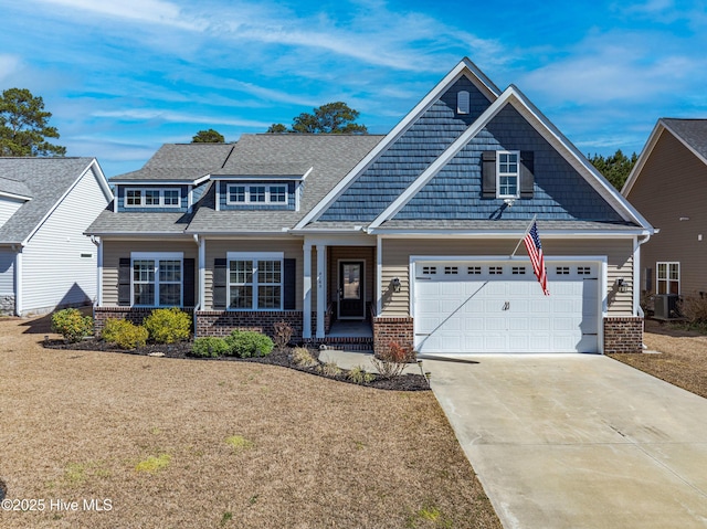 view of front of property with brick siding, central AC unit, driveway, and a shingled roof