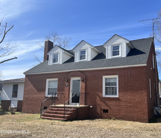 view of front of property featuring brick siding, crawl space, a chimney, and a shingled roof