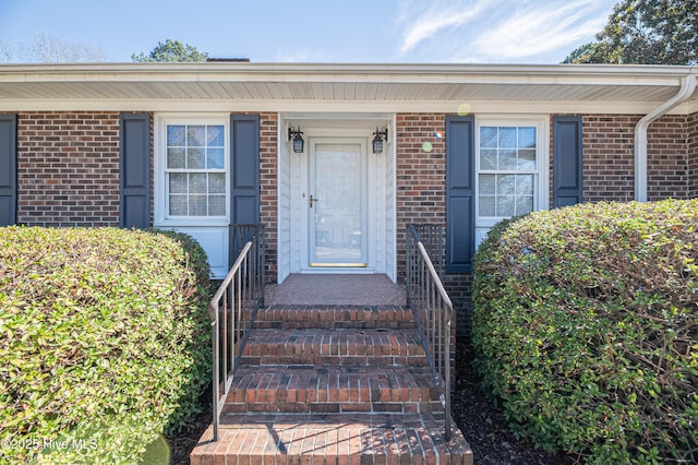 entrance to property with brick siding