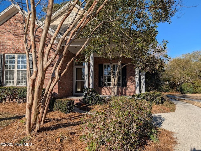 view of front of house with brick siding