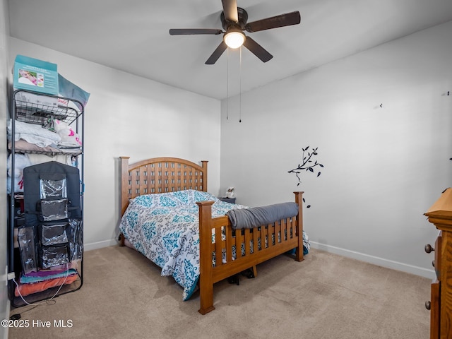 bedroom with carpet flooring, a ceiling fan, and baseboards