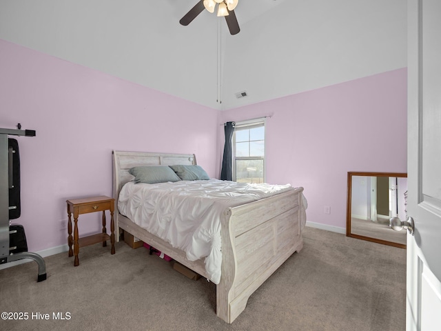 bedroom featuring visible vents, light colored carpet, baseboards, and lofted ceiling