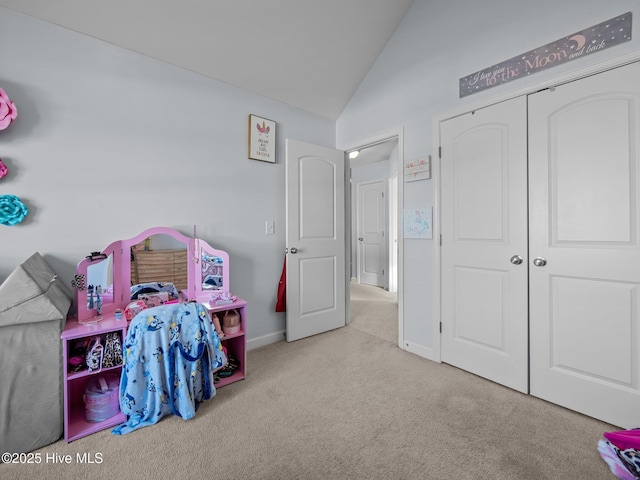 rec room with baseboards, lofted ceiling, and carpet