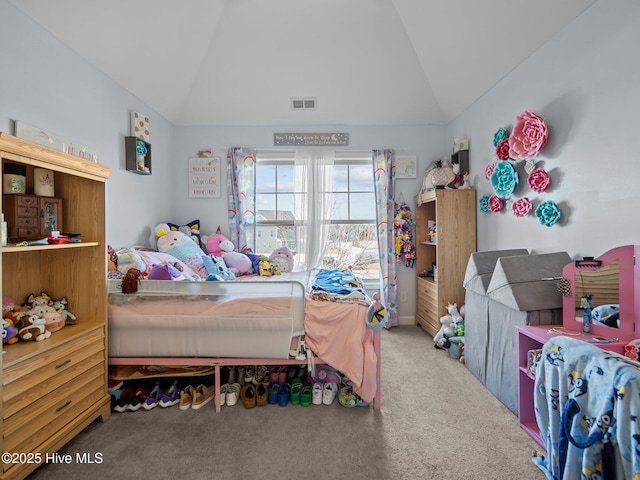 bedroom with lofted ceiling, carpet flooring, and visible vents