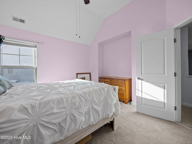 bedroom featuring light carpet, visible vents, a ceiling fan, and vaulted ceiling