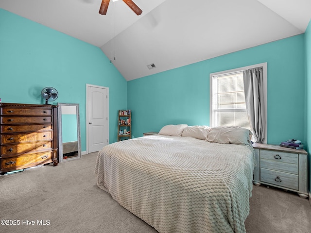 carpeted bedroom featuring visible vents, ceiling fan, and lofted ceiling