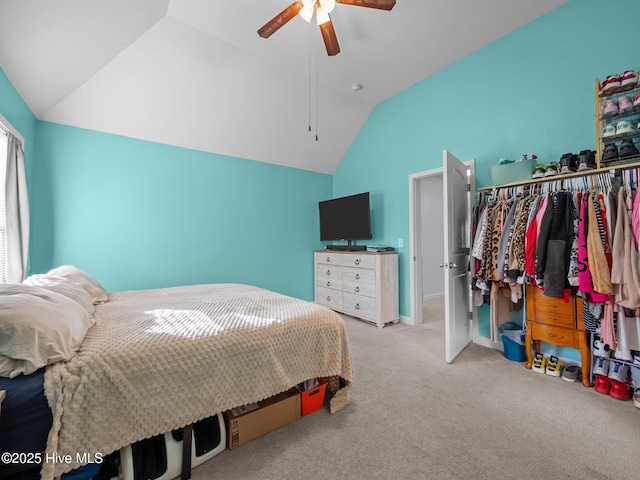 bedroom featuring a ceiling fan, carpet, and vaulted ceiling