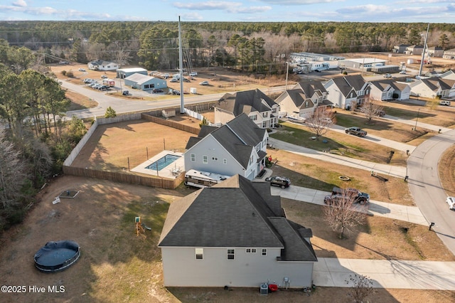 bird's eye view featuring a wooded view