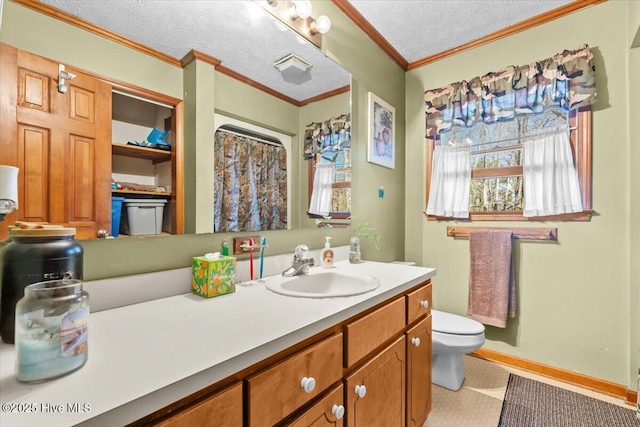 full bath featuring a textured ceiling, toilet, vanity, baseboards, and crown molding