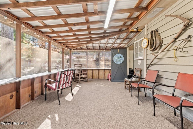 sunroom featuring lofted ceiling