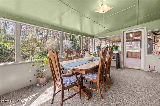 living room featuring crown molding, wood finished floors, and plenty of natural light