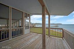 wooden deck featuring a water view