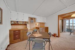 dining area with light carpet