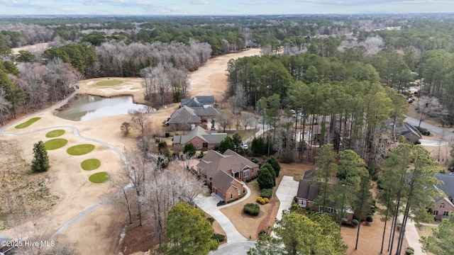 aerial view featuring a water view and a forest view