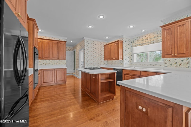 kitchen featuring wallpapered walls, open shelves, light wood-style floors, black appliances, and crown molding