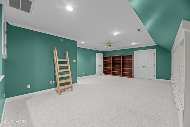 interior space featuring recessed lighting, a ceiling fan, baseboards, visible vents, and crown molding