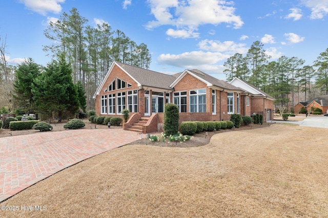 view of front of property featuring brick siding