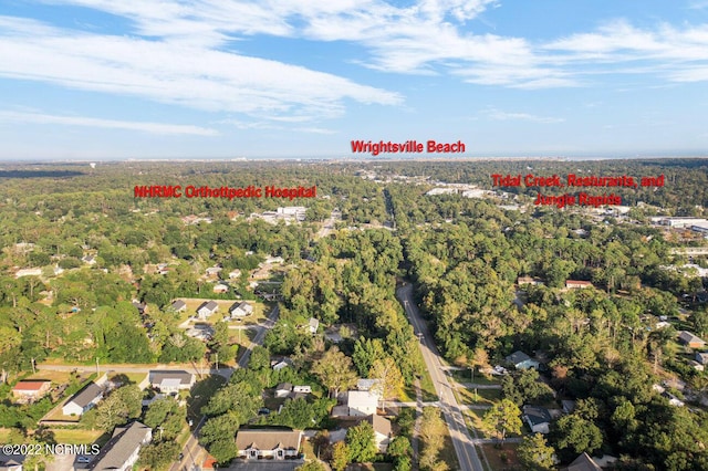 birds eye view of property with a forest view