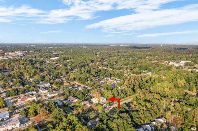 aerial view featuring a view of trees