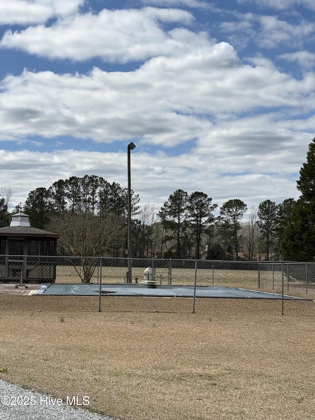 surrounding community featuring fence