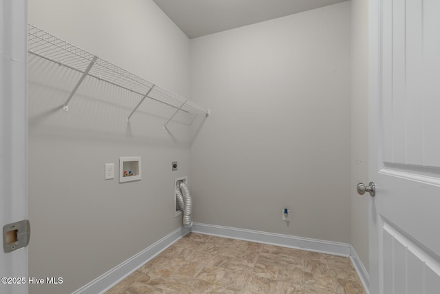 laundry area featuring laundry area, washer hookup, electric dryer hookup, and baseboards