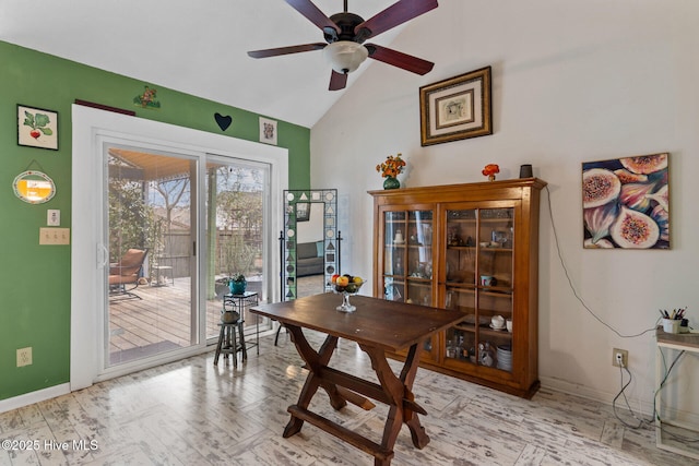 office with a ceiling fan, vaulted ceiling, baseboards, and wood finished floors