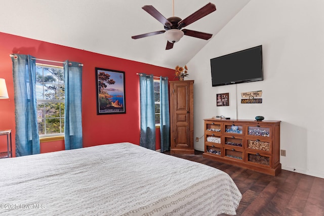 bedroom featuring lofted ceiling, a ceiling fan, and wood finished floors