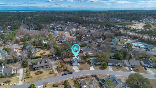 bird's eye view with a residential view and a view of trees