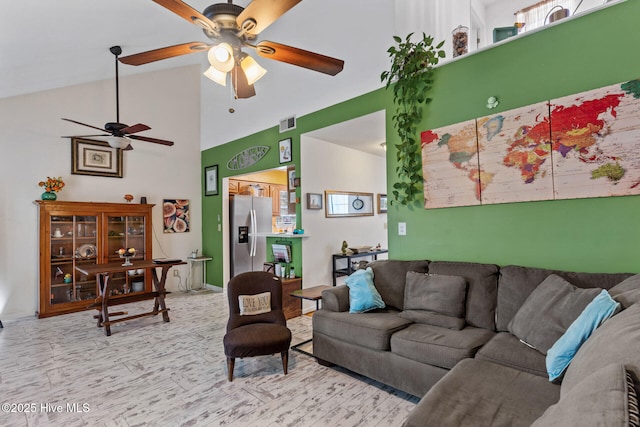 living room featuring high vaulted ceiling, visible vents, and ceiling fan