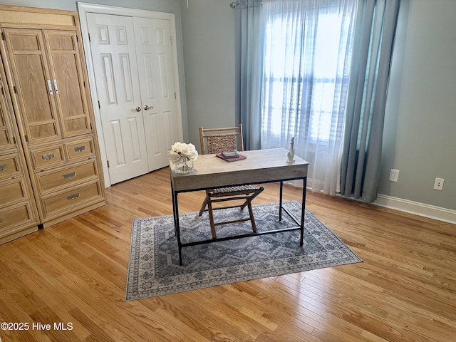 office featuring light wood finished floors and baseboards