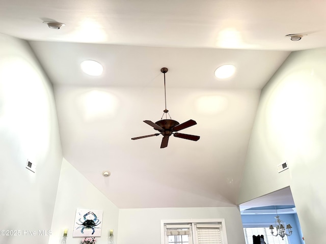 details featuring visible vents and ceiling fan with notable chandelier