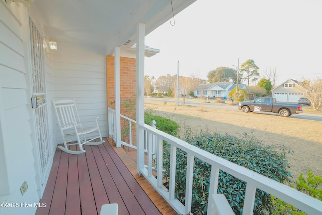 balcony featuring a residential view and a porch