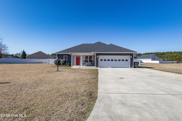 ranch-style home with a garage, fence, a front lawn, and concrete driveway