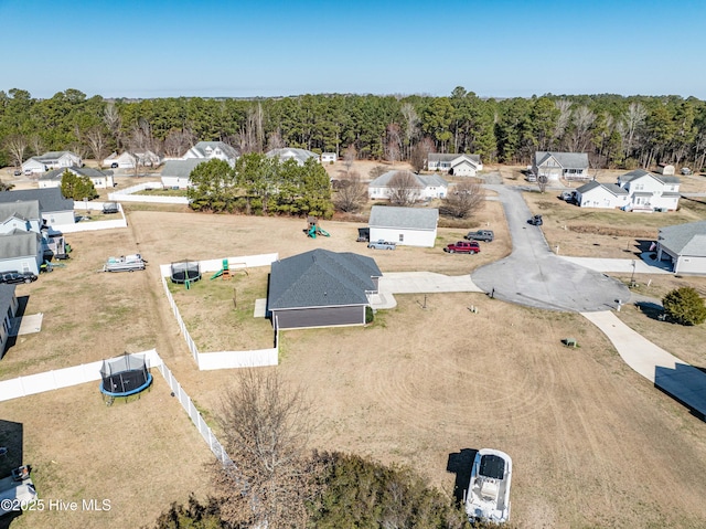 drone / aerial view featuring a view of trees