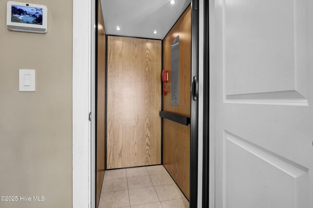 details featuring recessed lighting and elevator