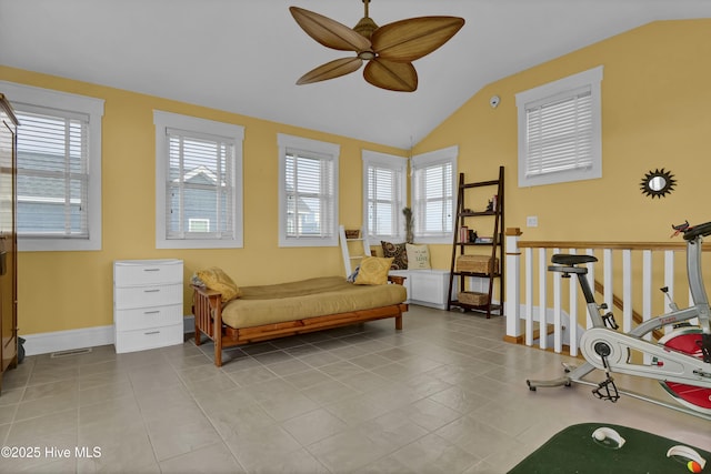 sitting room with a wealth of natural light, a ceiling fan, and vaulted ceiling