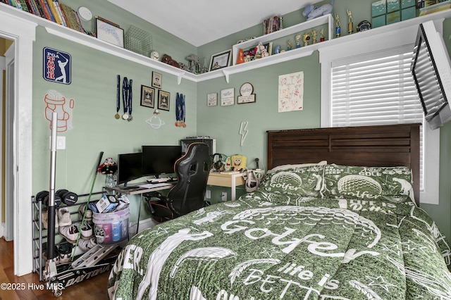 bedroom with wood finished floors